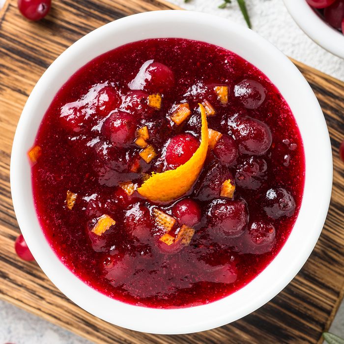 Cranberry sauce or cranberry jam with orange and rosemary. Top view on light stone table.; Shutterstock ID 1318144853; Job (TFH, TOH, RD, BNB, CWM, CM): TOH
