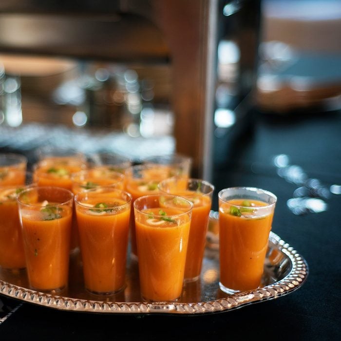 tomato or butternut squash soup shooters on buffet table