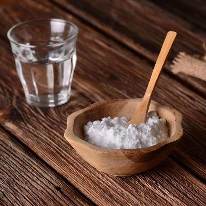 genius holiday tips - baking soda into the bowl with wooden spoon