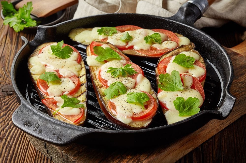 cooking mistakes - grilled eggplants with tomato and cheese on cooking pan