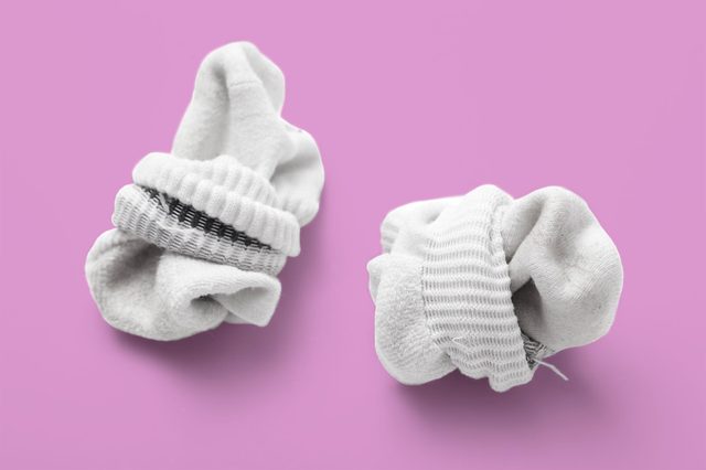 used sock isolated on a white background balled up
