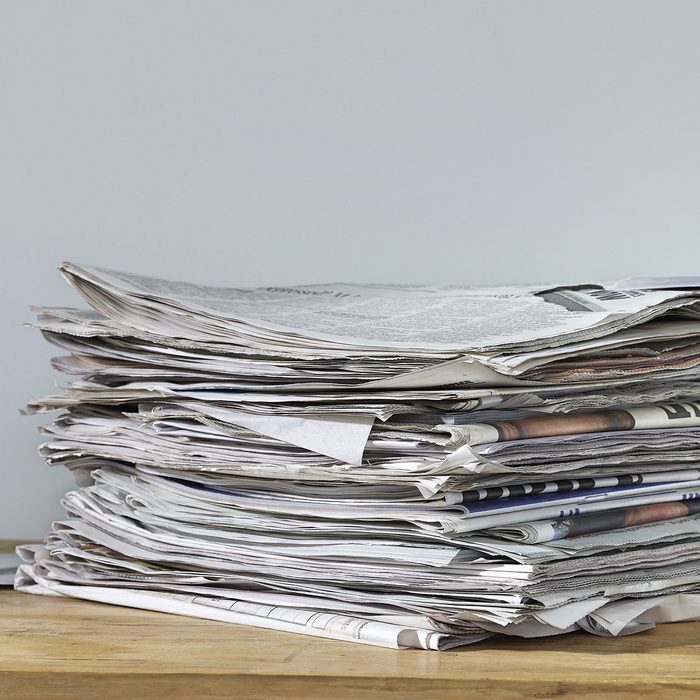 genius holiday tips - Stack of newspapers on table