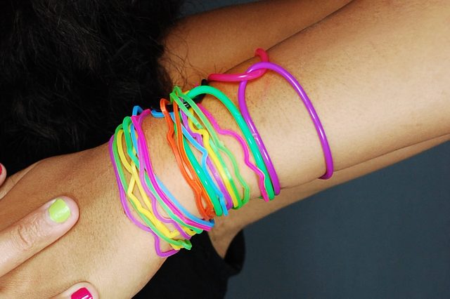 Young female model wearing colorful bracelets/Vibrant Is Always Better
