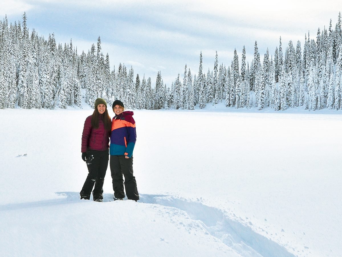 Canadian winter - two young women at Poland Lake, B.C.