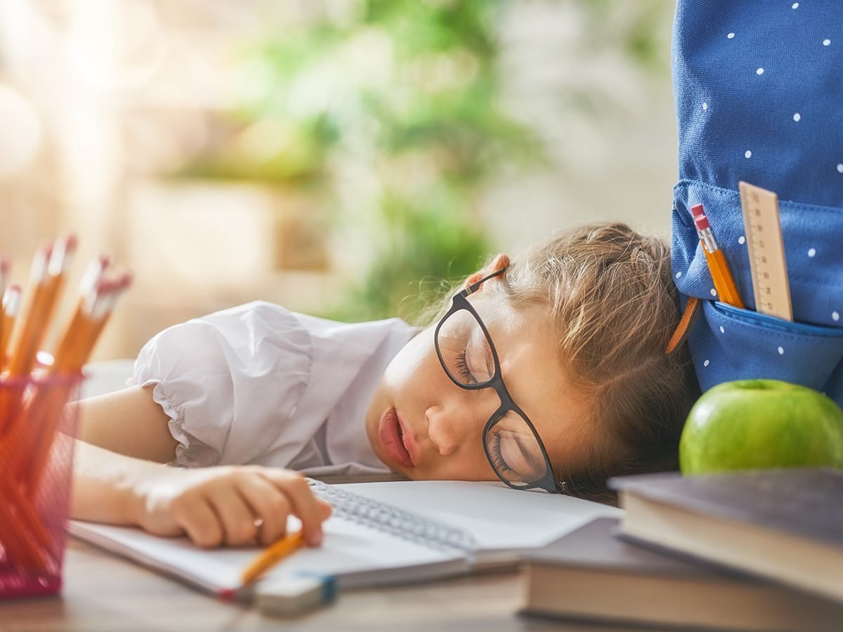 Funny parenting tweets - tired kid sleeping at desk