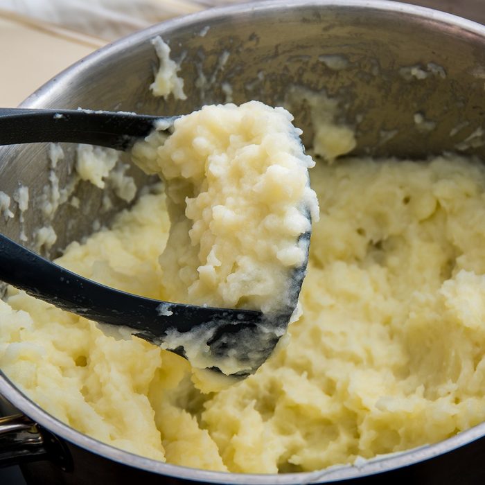 holiday cooking tips - Cooking boiled potatoes in the mashed potatoes in a metal pan; Shutterstock ID 1061454149; Job (TFH, TOH, RD, BNB, CWM, CM): TOH