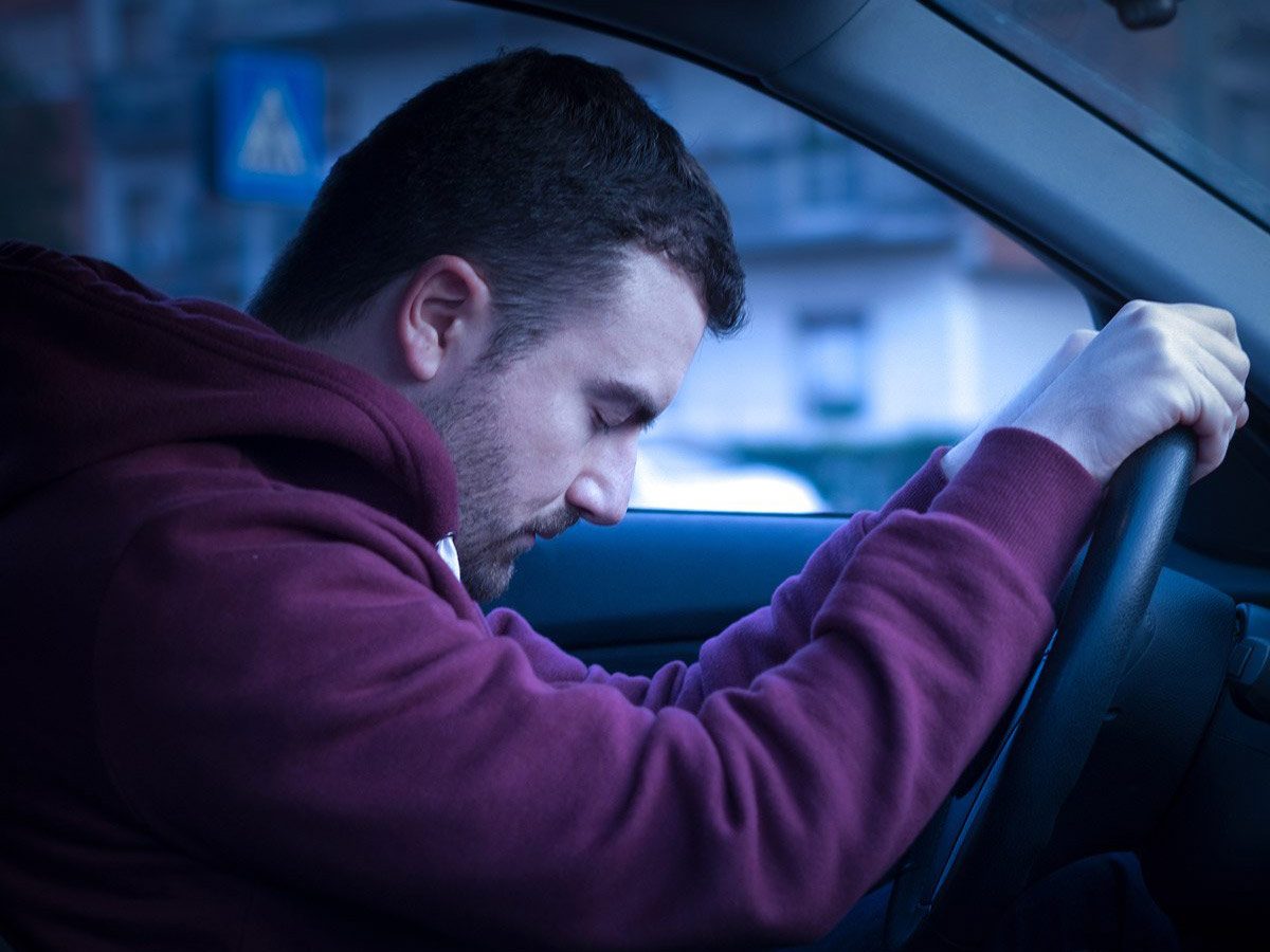 Man falling asleep at the wheel