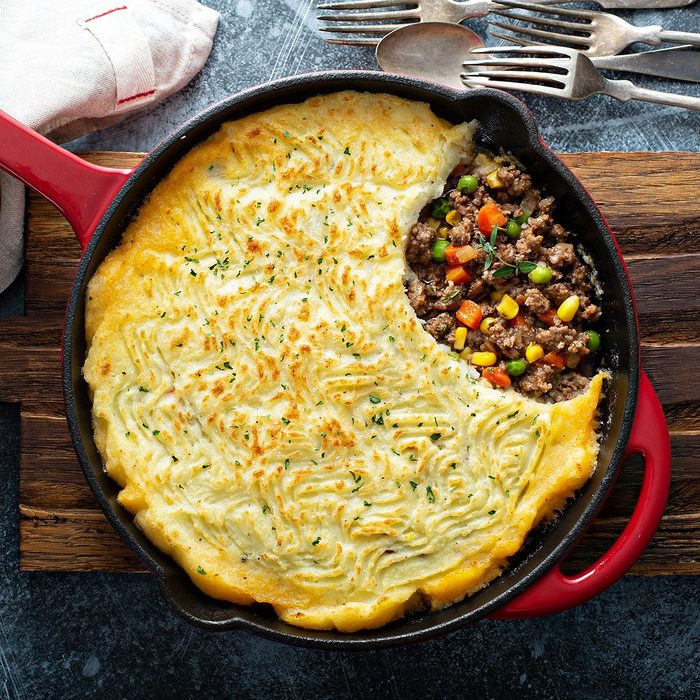 depression-era cooking tips - Shepherds pie with ground meat, vegetables and potatoes in a cast iron pan top view; Shutterstock ID 1329534653; Job (TFH, TOH, RD, BNB, CWM, CM): TOH