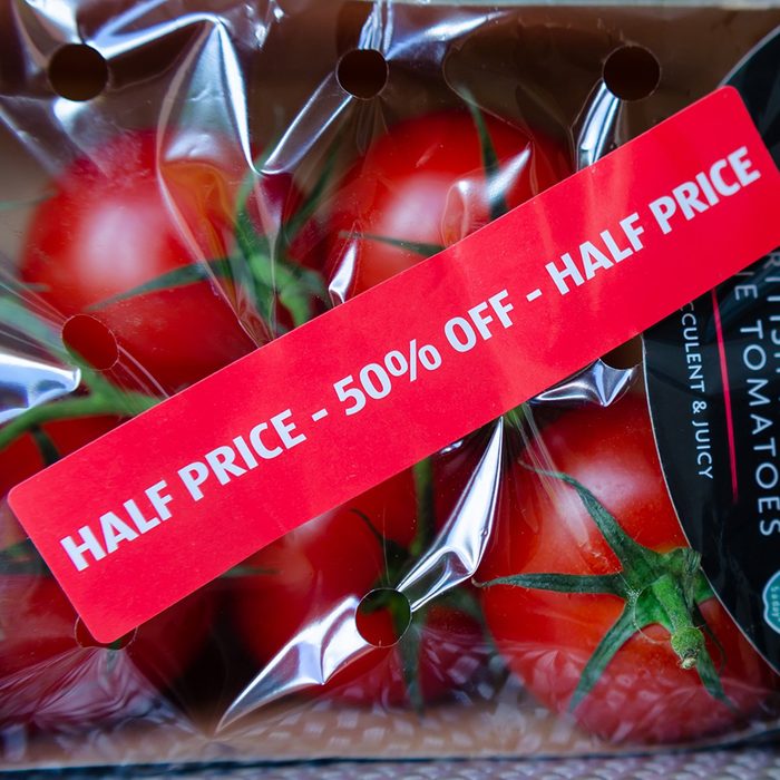 depression-era cooking tips - Stone, Staffordshire / UK - July 1 2019: Pack of British Regal Vine Tomatoes with discount label from ALDI supermarket. Short dated vegetables on clearance are with label: "Half price, 50% off"; Shutterstock ID 1439340539; Job (TFH, TOH, RD, BNB, CWM, CM): TOH