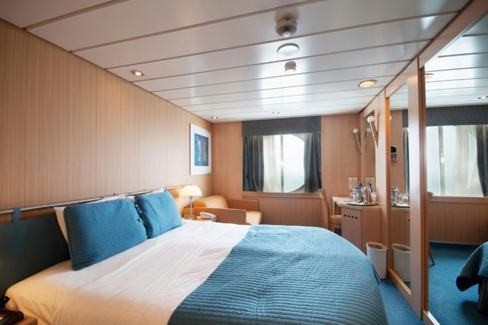 Interior of an ocean view cruise ship cabin
