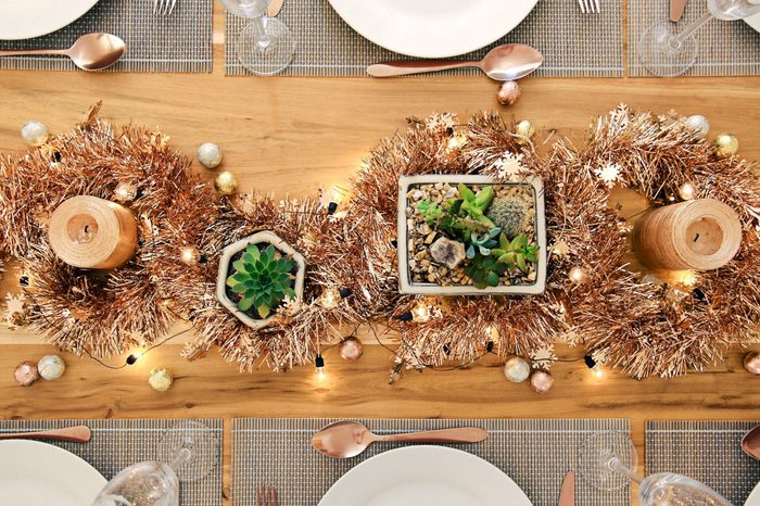 Metallic Holiday rustic table setting with succulents from above