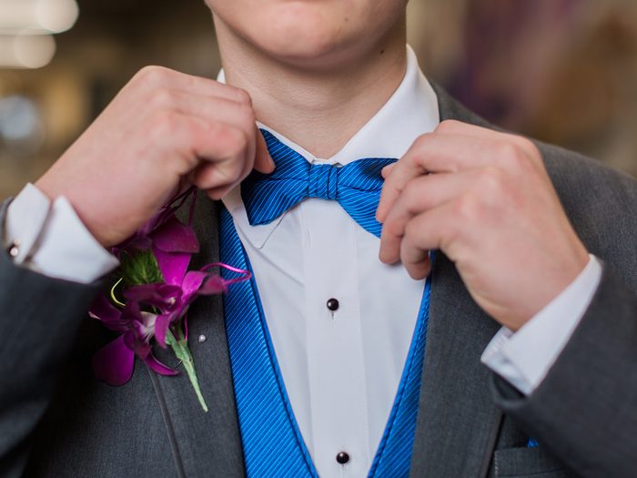 Male teenager getting ready for prom