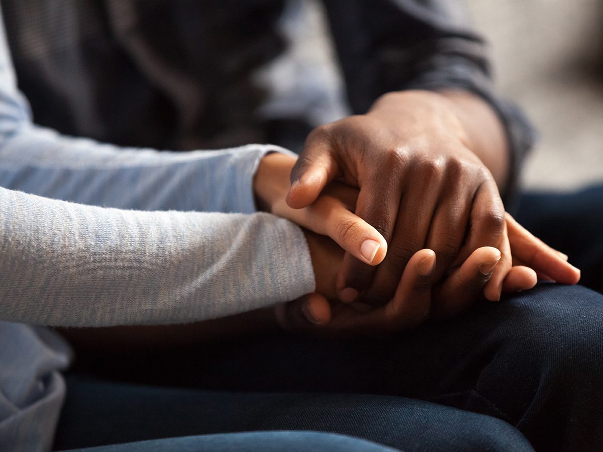 Health benefits of meditation - compassionate holding hands