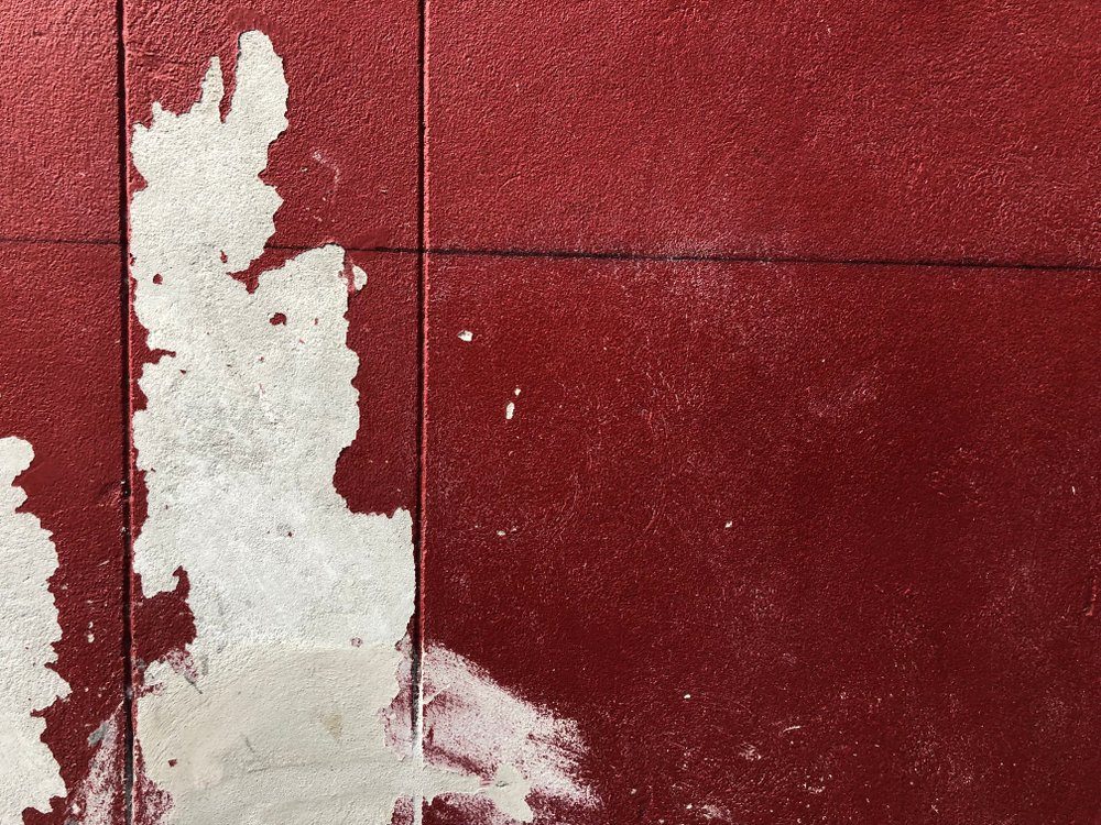 Old terracotta painted stucco clay wall paint. Abstract red paint wall texture background.