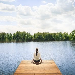 Benefits of being alone - woman alone on dock