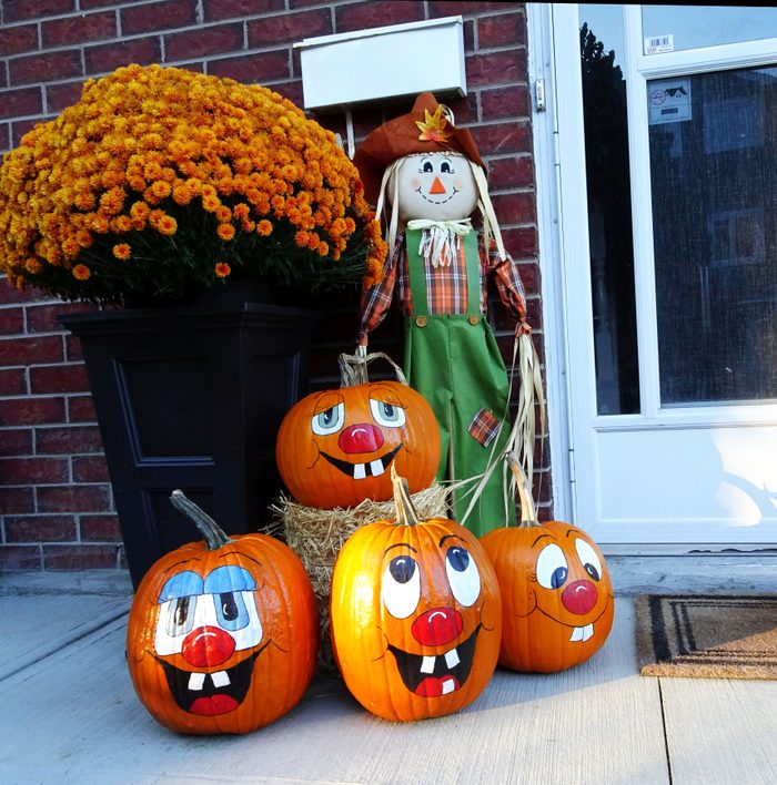 Pumpkins with smiling painted faces
