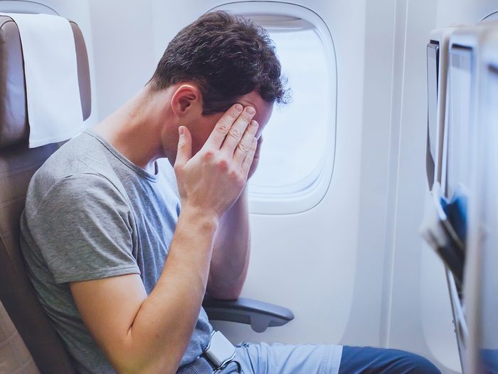 How to cure motion sickness - sick man on flight