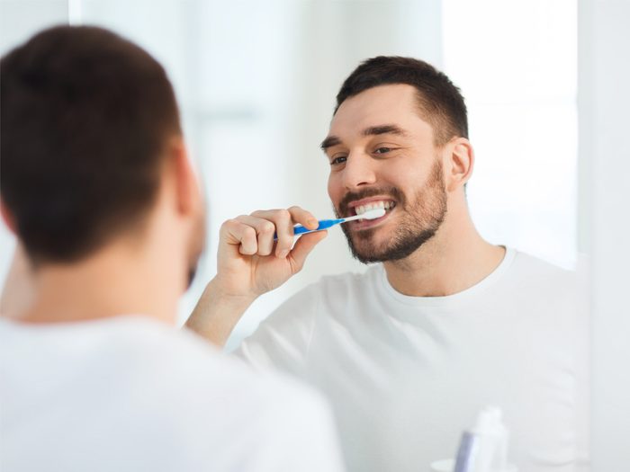 How to live to 100 - Man brushing teeth