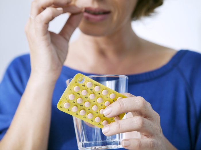 How to live to 100 - Woman taking an HRT pill