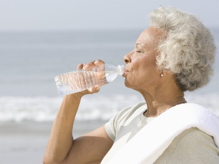 How to live to 100 - Woman drinking from water bottle