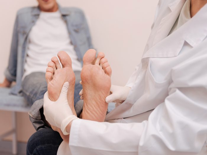 How to live to 100 - Doctor examining patient's feet