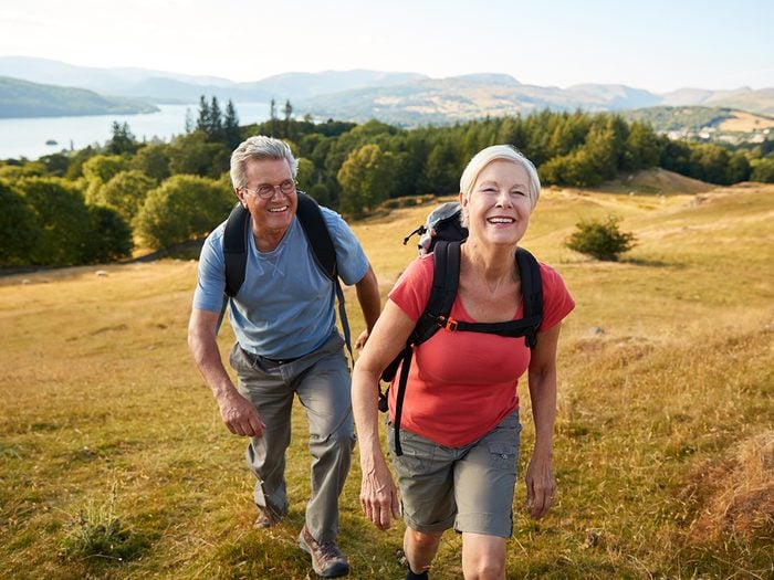 Signs you need more exercise - mature couple happy hiking
