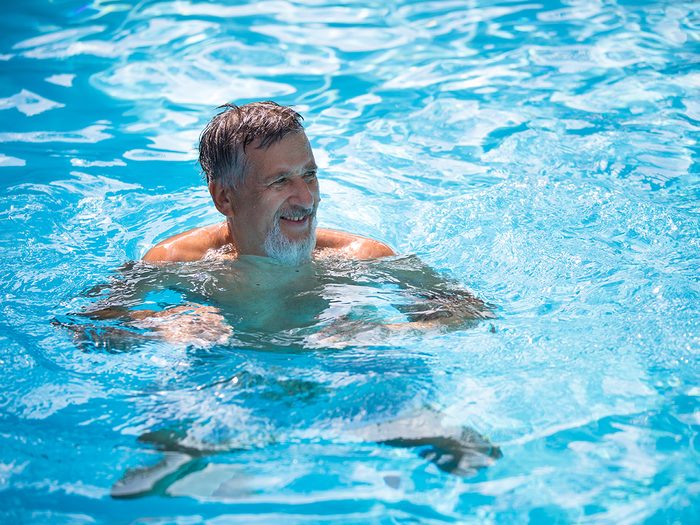 Signs you need more exercise - mature man swimming in pool