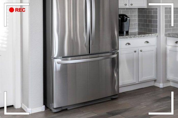 close up on refrigerator with bottom drawer freezer in a kitchen.