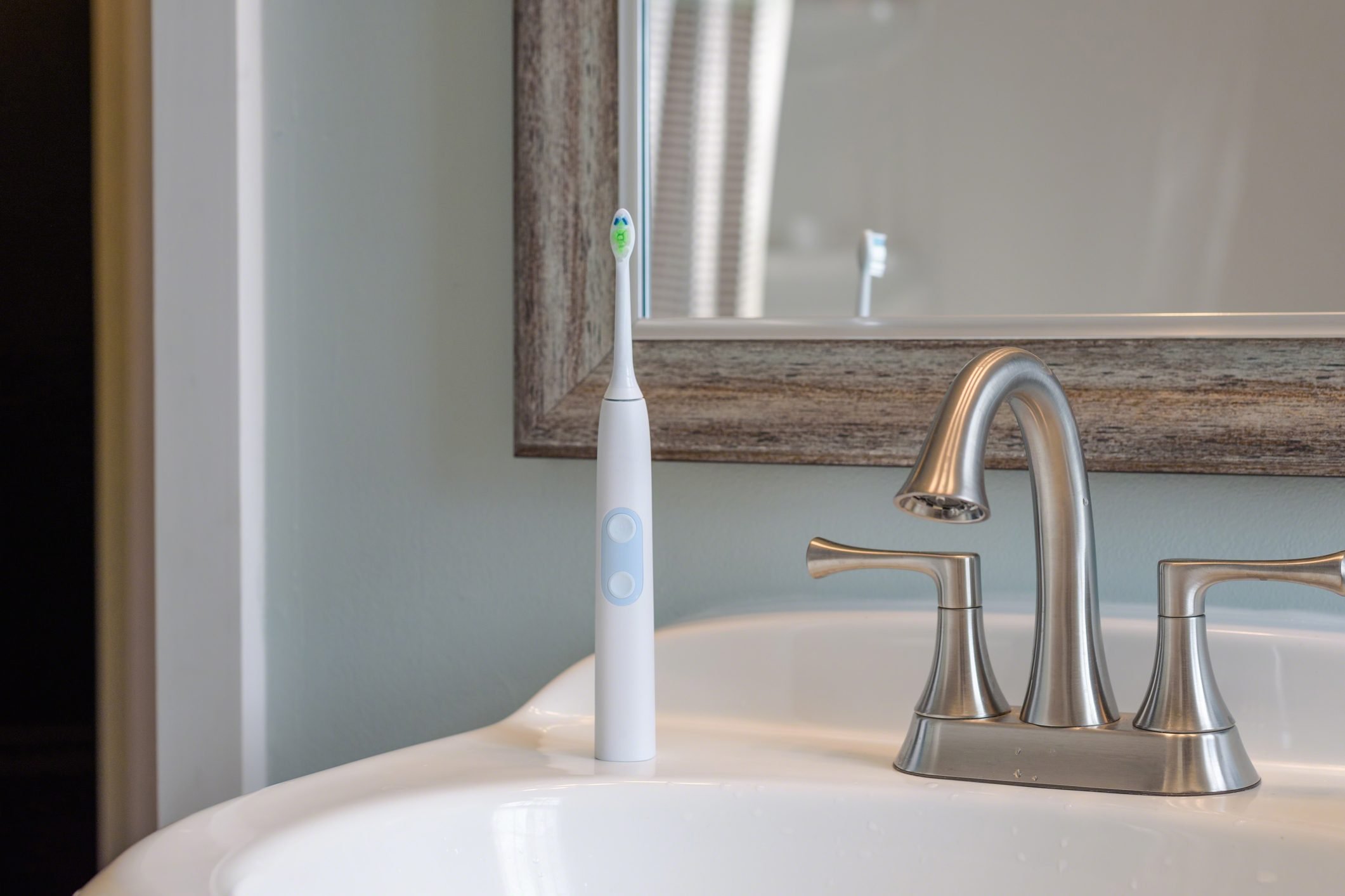electric toothbrush in bathroom