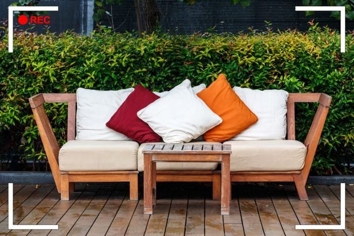 outdoor couch with cushions and pillows.
