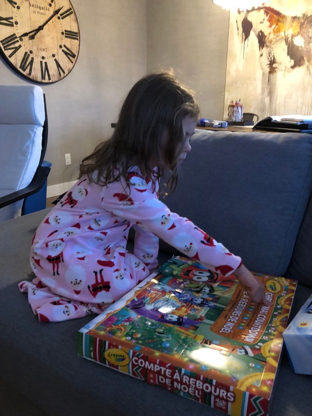 Girl opening and advent calendar