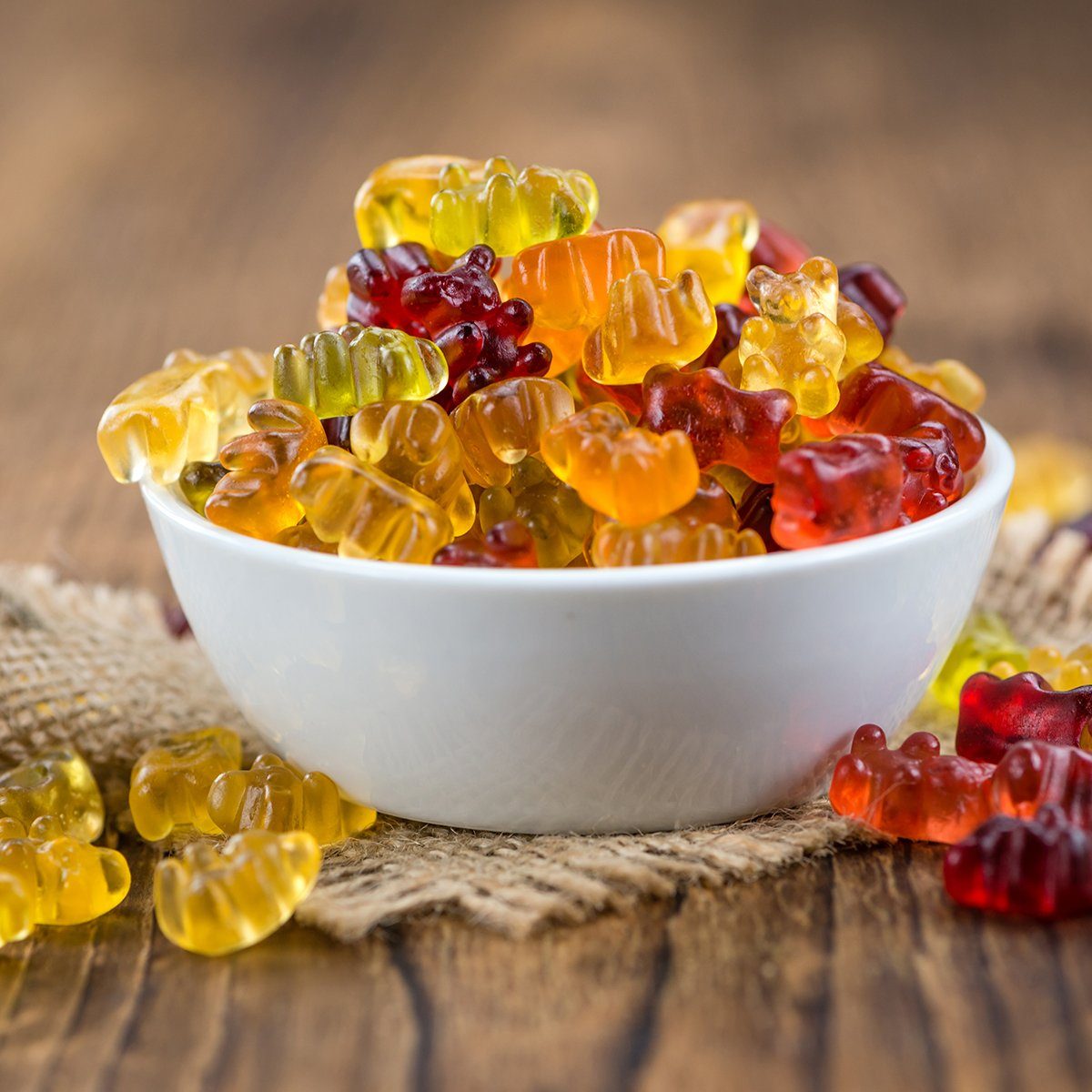 Fruity Gummy Bears (close-up shot) on an old wooden table