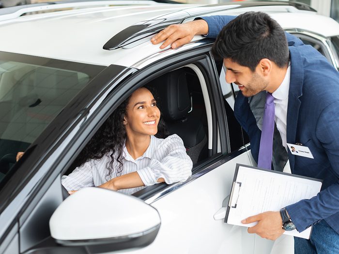 New car incentives - woman buying new car