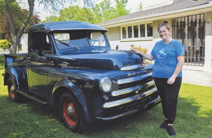 MIllie's granddaughter Jaclyn with the restored Dodge