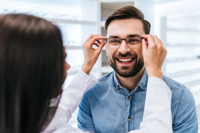 Signs you need new glasses - Doctor and patient in modern ophthalmology clinic