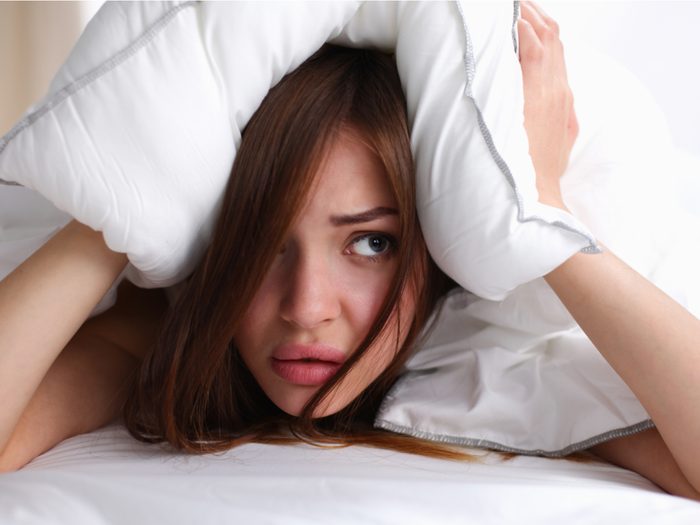 Woman waking up stressed out