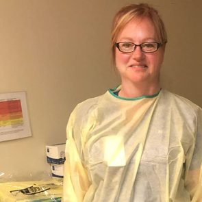 Ontario ER nurse Cynthia Rennie-Faubert stands in her scrubs