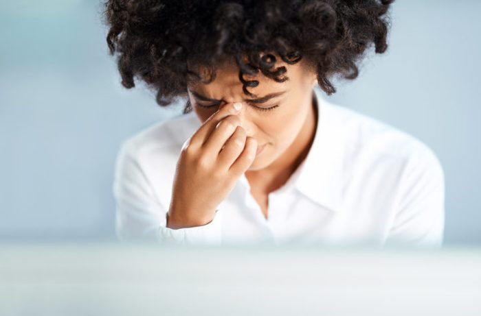 black woman sinus headache pressure stress