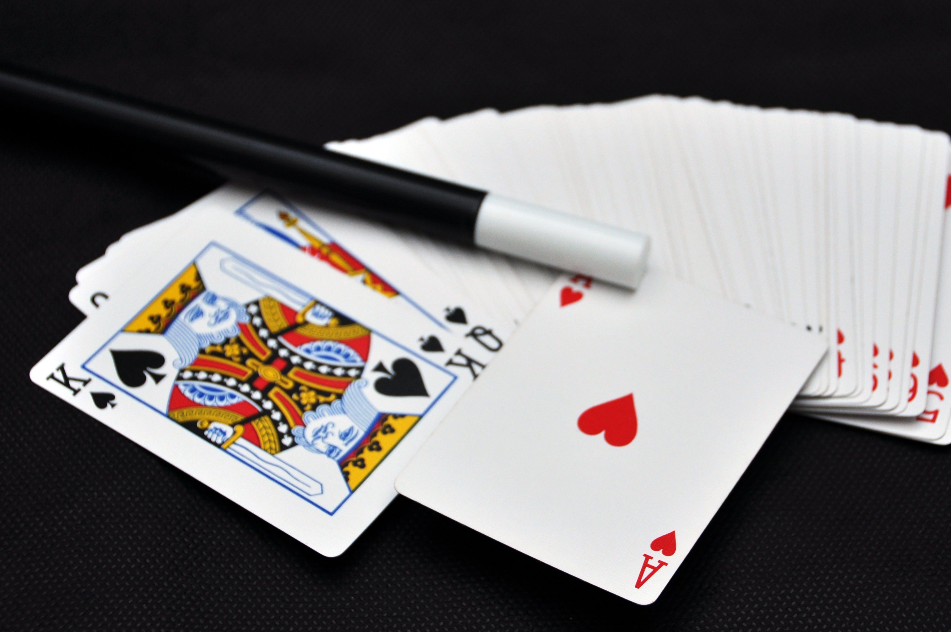 Playing card with magic wand