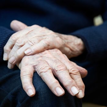 Early signs of Parkinson's disease - senior hands