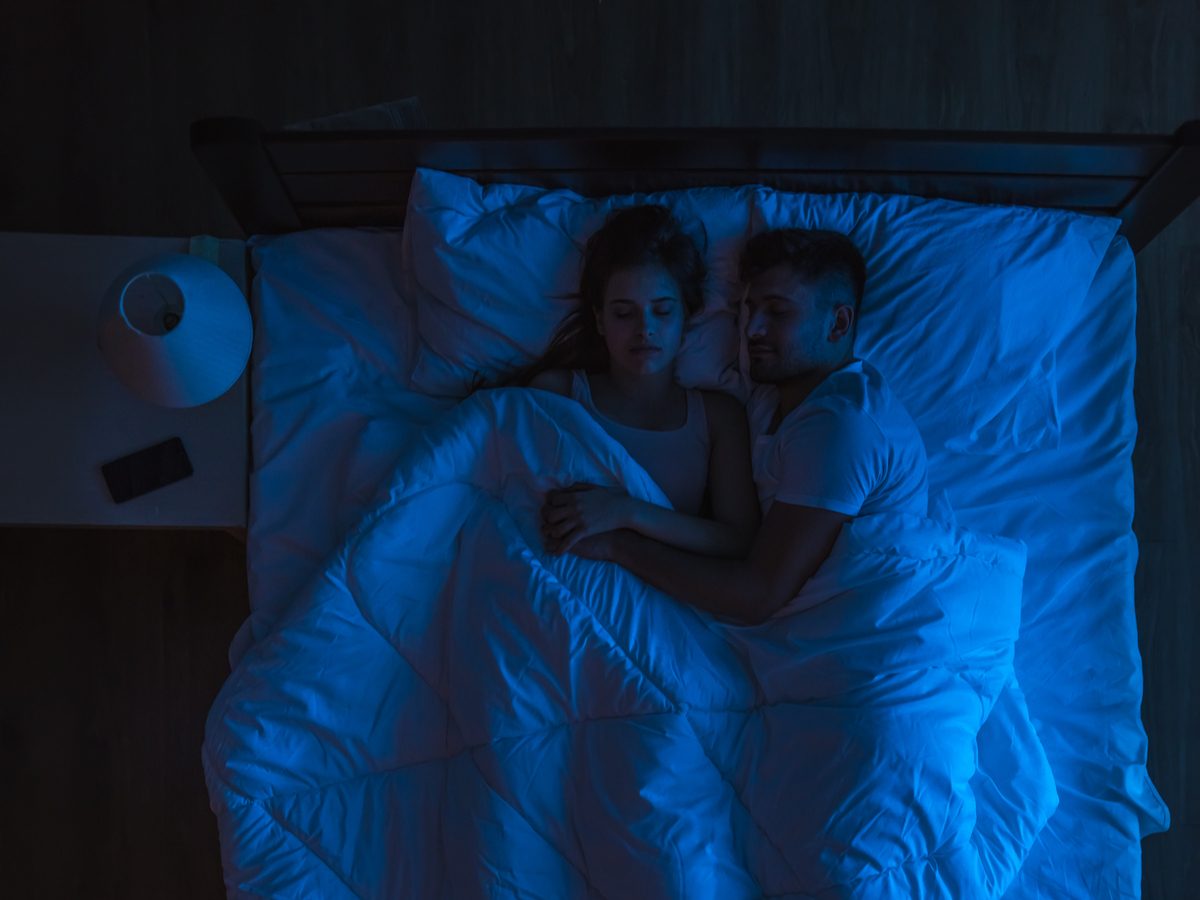 Couple sleeping in the dark