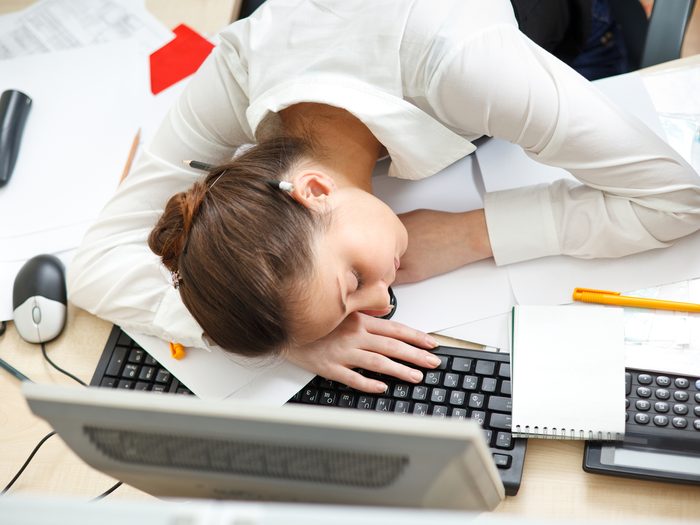 Sleep jokes - tired woman sleeping on laptop
