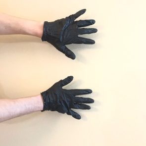 Hands with black nitrile gloves