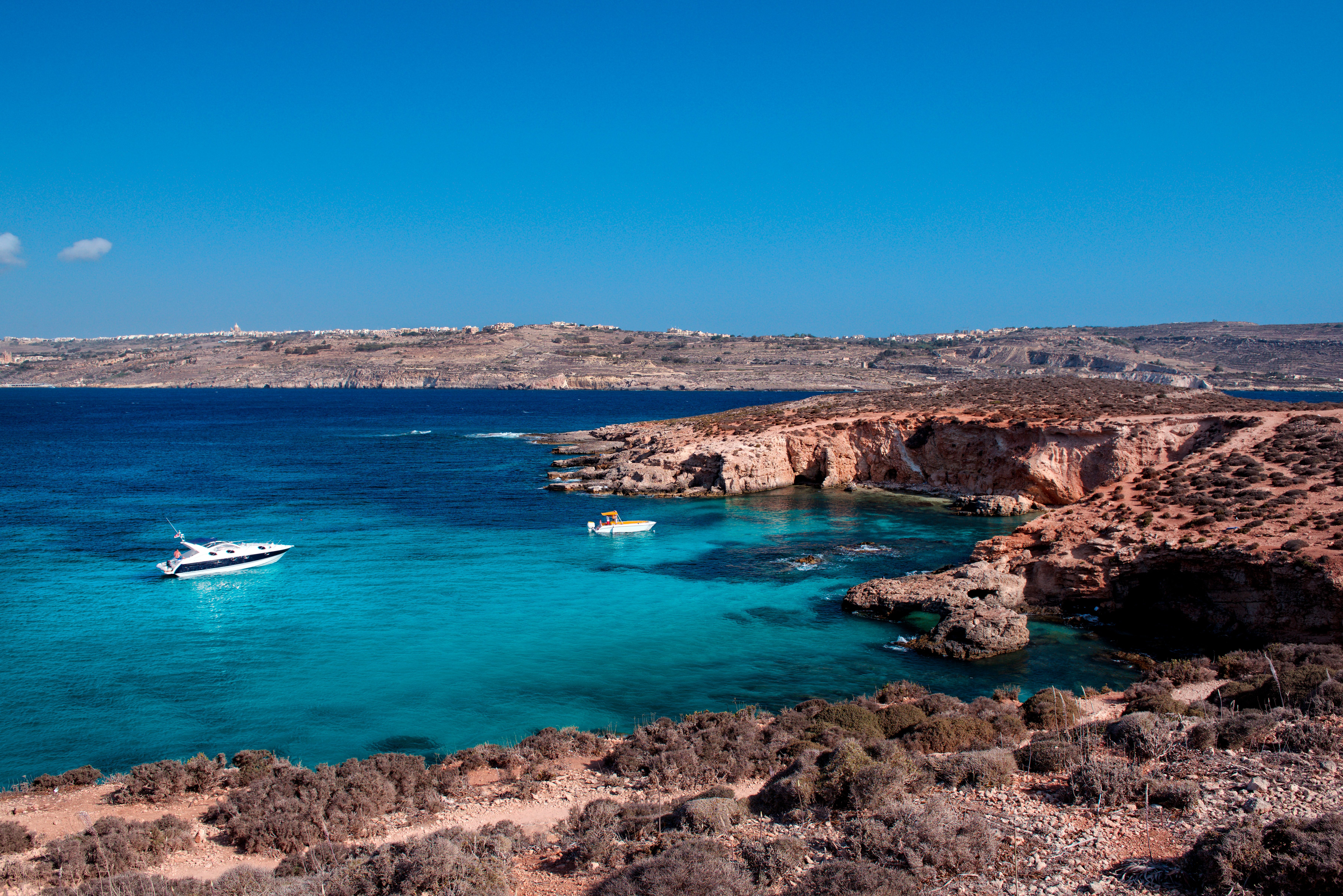 Boats anchored in Blue Lagoon, Comino Island, Gozo, Malta