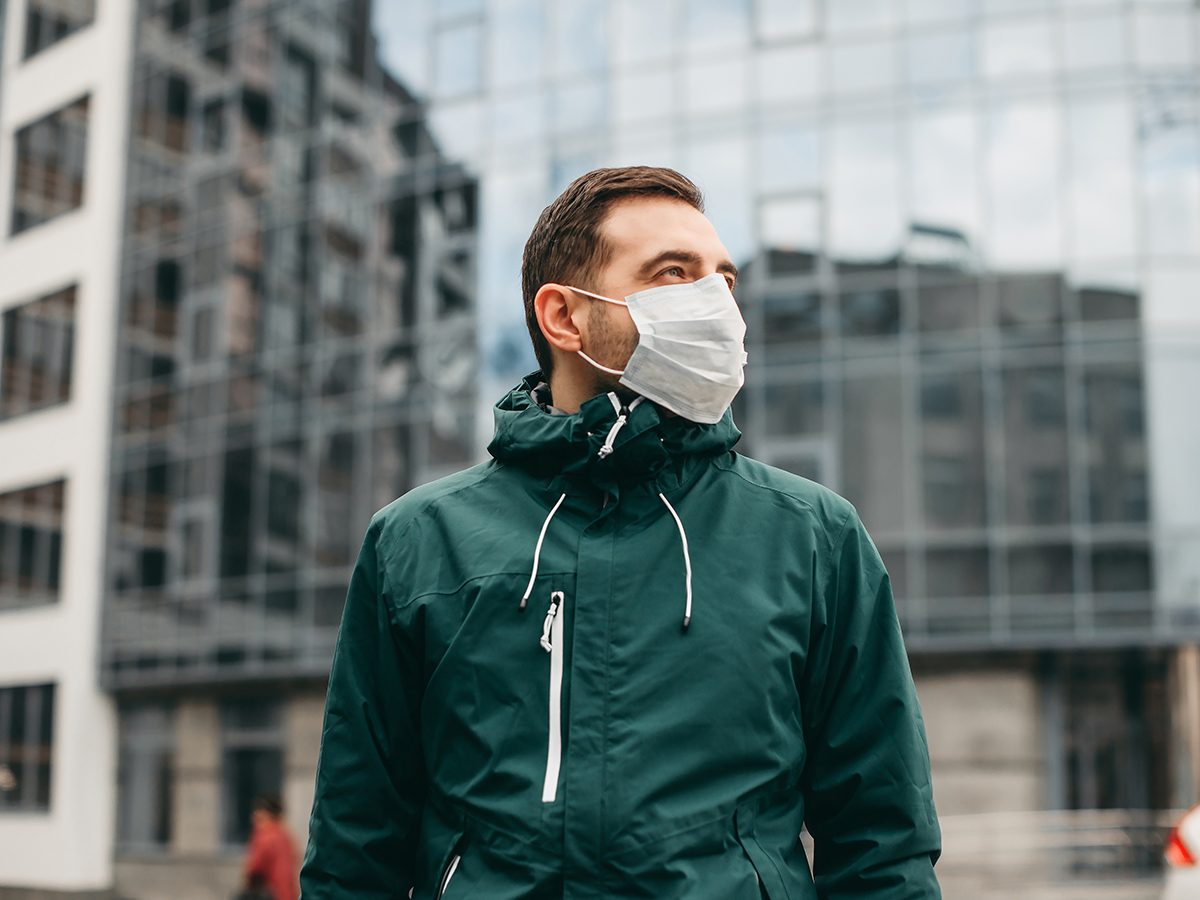 Man wearing a face mask outside on street