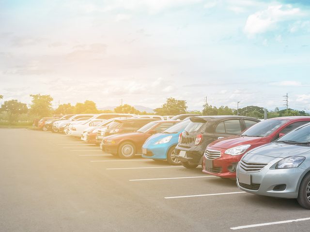 Beat summer heat - parking lot filled with parked cars