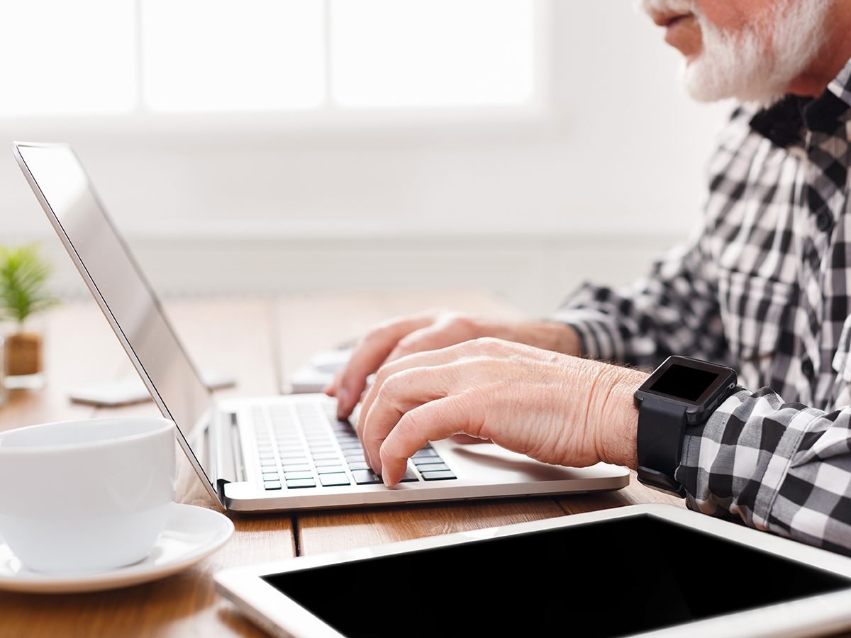 Caring for aging parents - senior on laptop