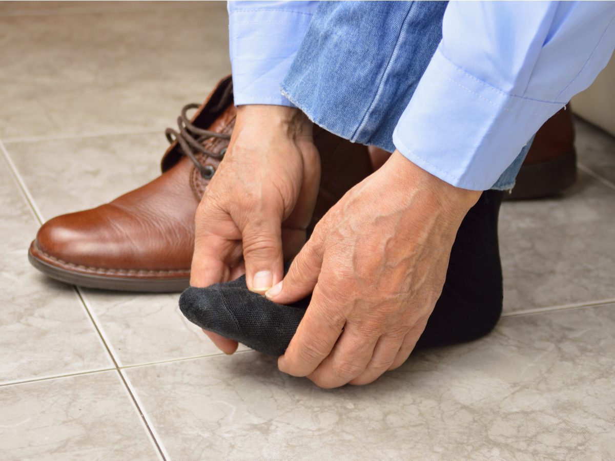 Businessman with aching feet