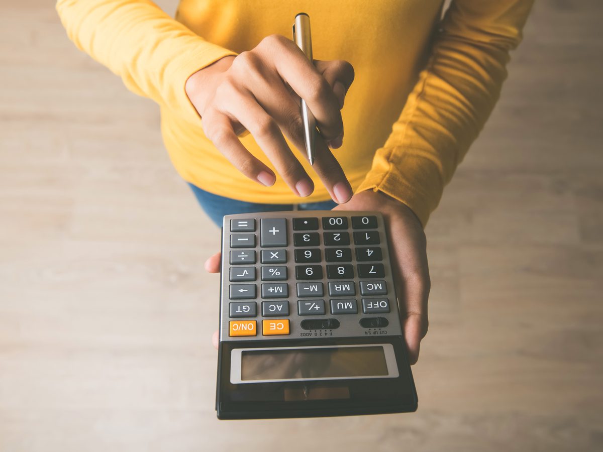 Woman holding a calculator