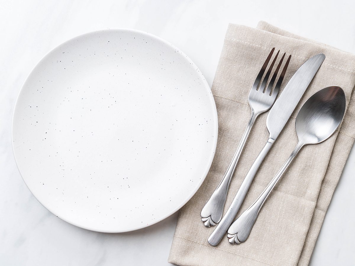 How to lose weight without exercise - setting the table with plate and cutlery